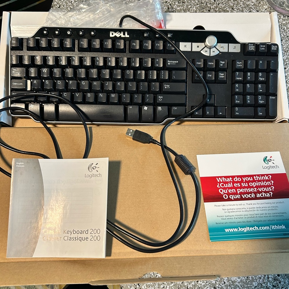 NWB Dell keyboard by Logitech. Setup manual included.